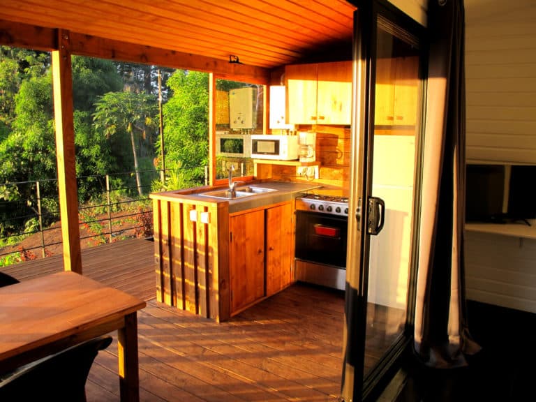 Fully equipped outdoor kitchen under shelter