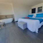 villa bounty king size bed and bathtub of the master suite