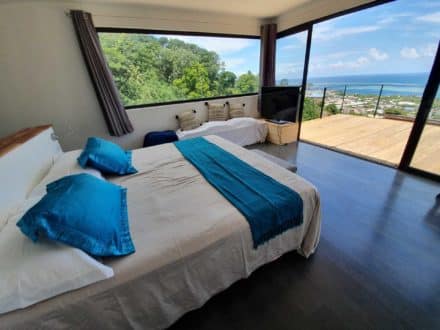 villa bounty king size bed of the master suite with ocen view