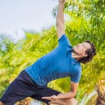 Man doing yoga in the Bounty Lodge Resort